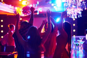 Young people dancing in nightclub